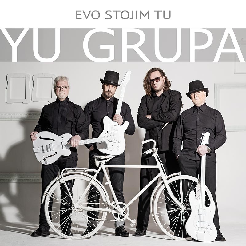 Omot albuma Yu grupa Evo stojim tu. Na fotografiji osnivaci yu grupe - braca Jelic
